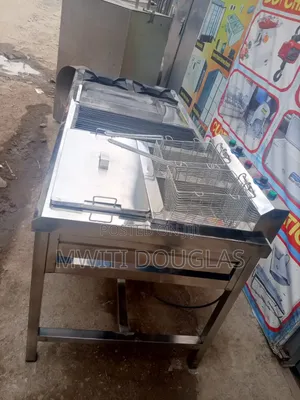 Combined Cooker With a Griddle, Grill, Burners and a Fryer