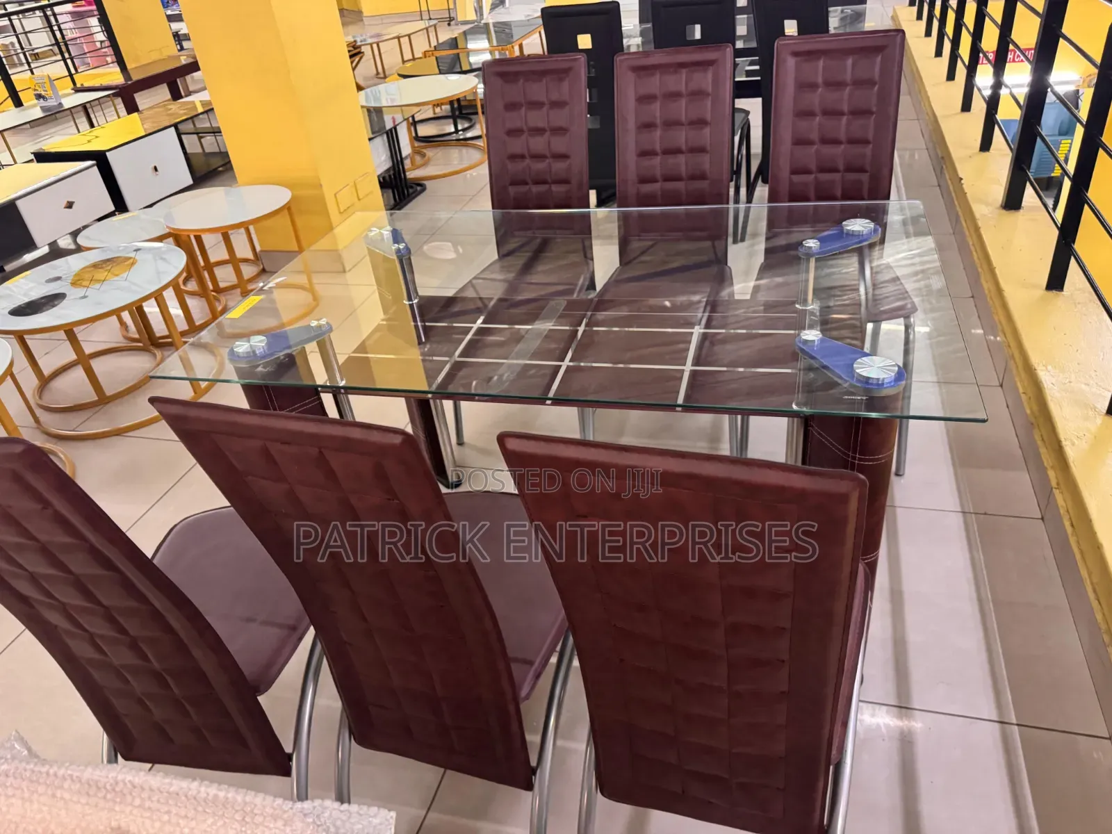 Glass Dining Set Six Seater With Distinct Red-Brown High-Back Chairs.