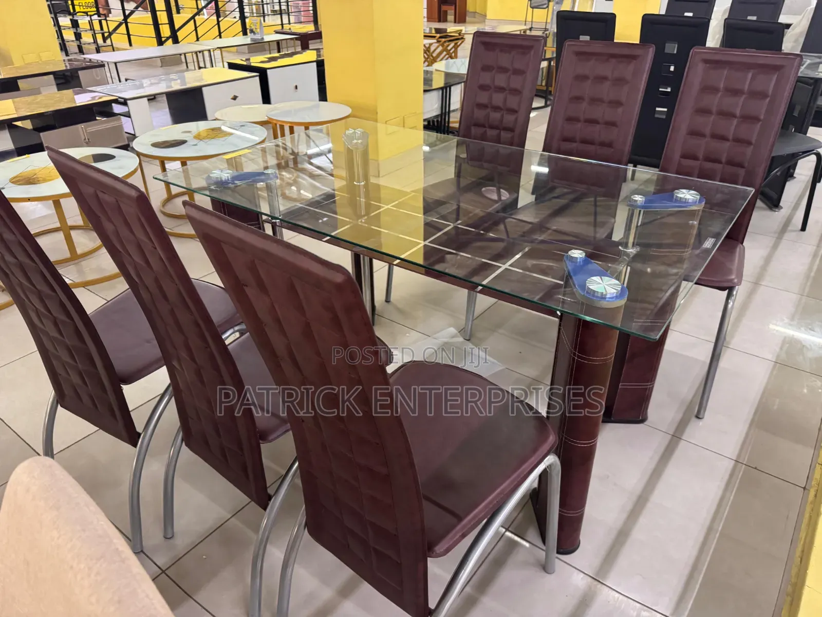 Glass Dining Set Six Seater With Distinct Red-Brown High-Back Chairs.