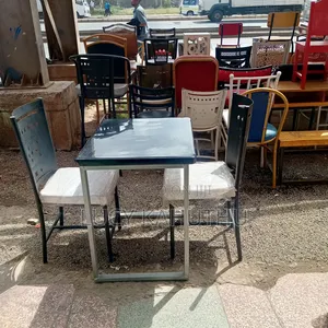 Grey Marble Top With Mabati Laser Cut Chairs