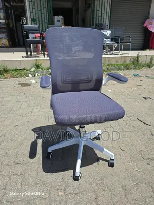 White Orthopedic Chair and a Table