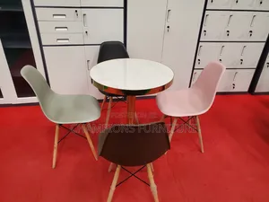 Gold Pedestal Table and Eames Chairs Set