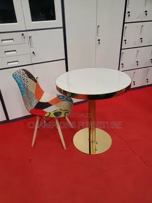 Gold Pedestal Table and Patchwork Accent Chair