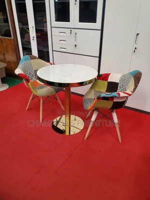 Gold Pedestal Table and Wide Patchwork Chairs
