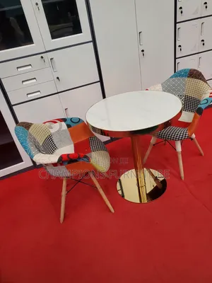 Gold Pedestal Table and Wide Patchwork Chairs