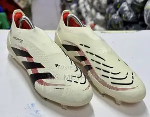 The Adidas Predator Elite Laceless FG Ruby Football Shoes