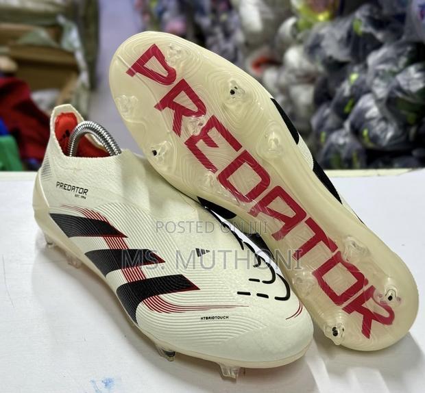 The Adidas Predator Elite Laceless FG Ruby Football Shoes