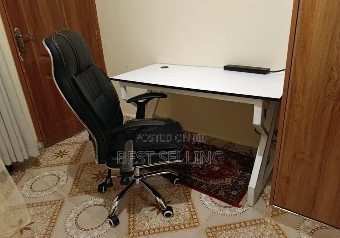 Elegant Office Desk With Metallic Base and Leather Chair