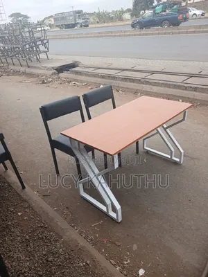 Metallic Office Table and Two Black Chairs