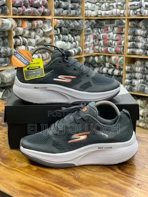 Dark Grey and Orange Skechers Max Cushioning Sneakers