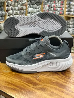 Dark Grey and Orange Skechers Max Cushioning Sneakers