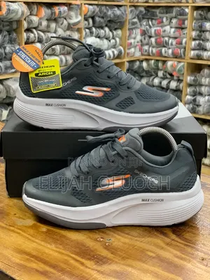 Dark Grey and Orange Skechers Max Cushioning Sneakers