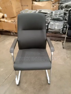 This Black Leather Cantilever Visitor Chair With Fixed Padded Arms
