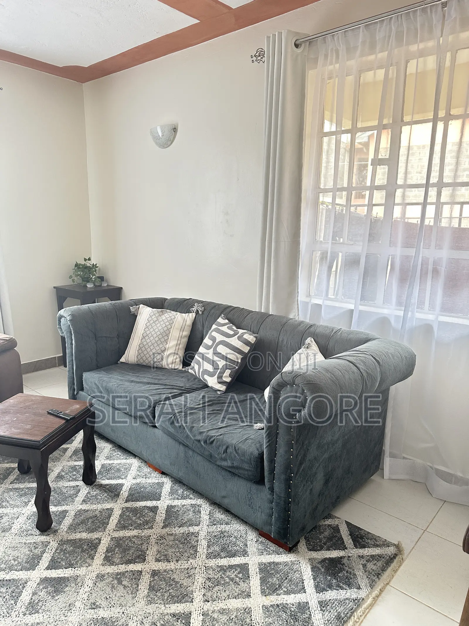 A Nice and Functional Used Blue Sofa for Sale