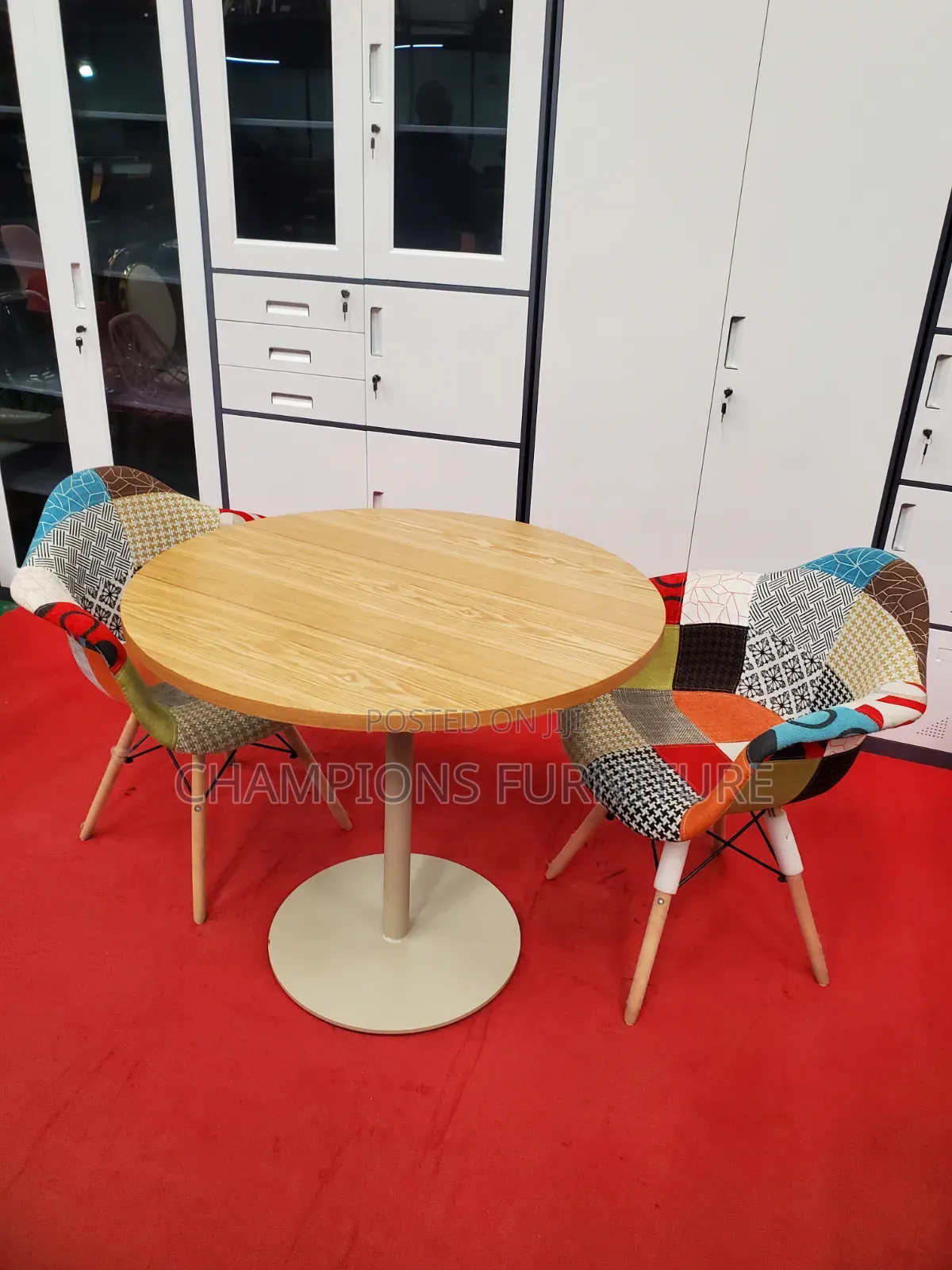 Brown Round Table and Patchwork Eames Chairs Set