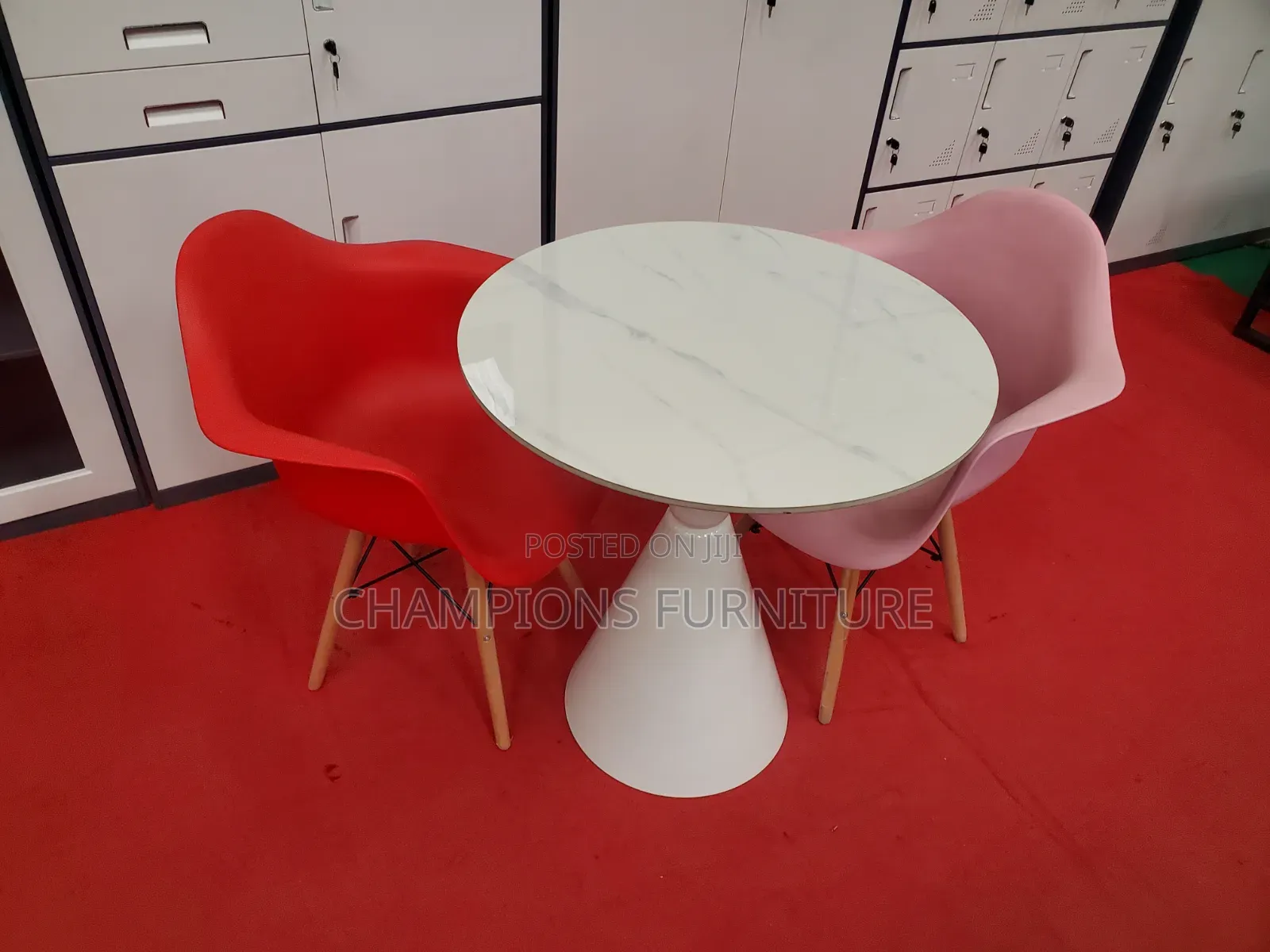 Round Trumpet Base Table and Eames Armchairs