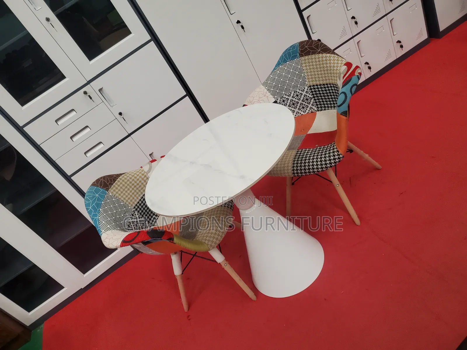 Round Trumpet Base Table and Patchwork Eames ArmChairs