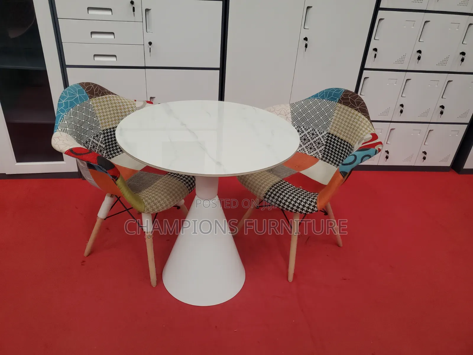 Round Trumpet Base Table and Patchwork Eames ArmChairs