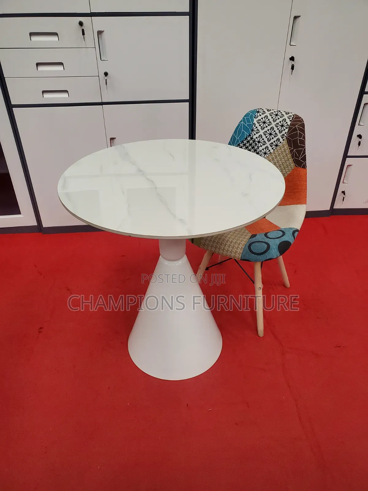 Round Trumpet Base Table and Patchwork Eames Chair