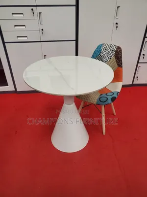 Round Trumpet Base Table and Patchwork Eames Chair