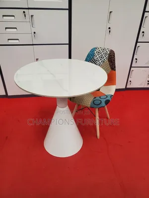 Round Trumpet Base Table and Patchwork Eames Chair