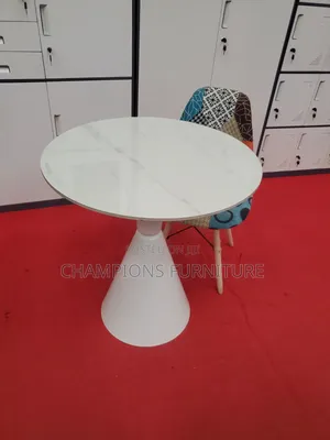 Round Trumpet Base Table and Patchwork Eames Chair