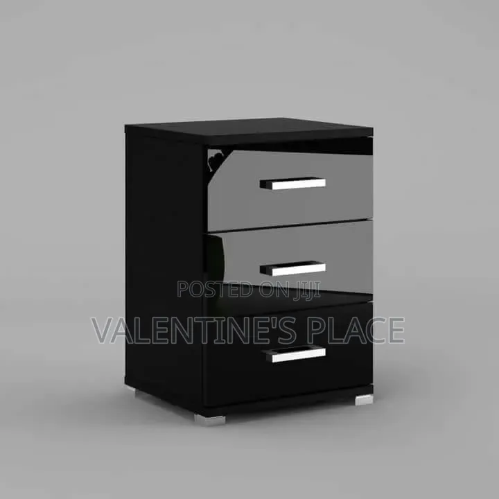 Sleek Black 3-Drawer Nightstand With a Modern High-Gloss Finish.