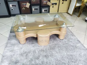 Tempered Glass Coffee Table With Brown Ottoman