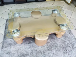 Tempered Glass Coffee Table With Brown Ottoman
