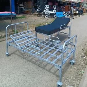 Examination Bed, Ward Bed, Drip Stand and a Drip Stand 