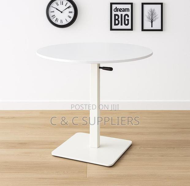Modern Round Adjustable Dining Table.