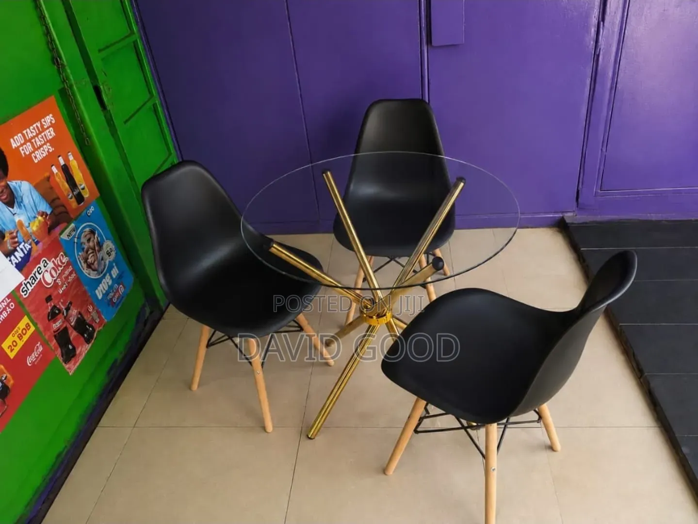 Golden Dining Table Round and Black Eames Chairs