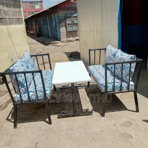 Two Metal Bench With Cushions and 4by 2 Table