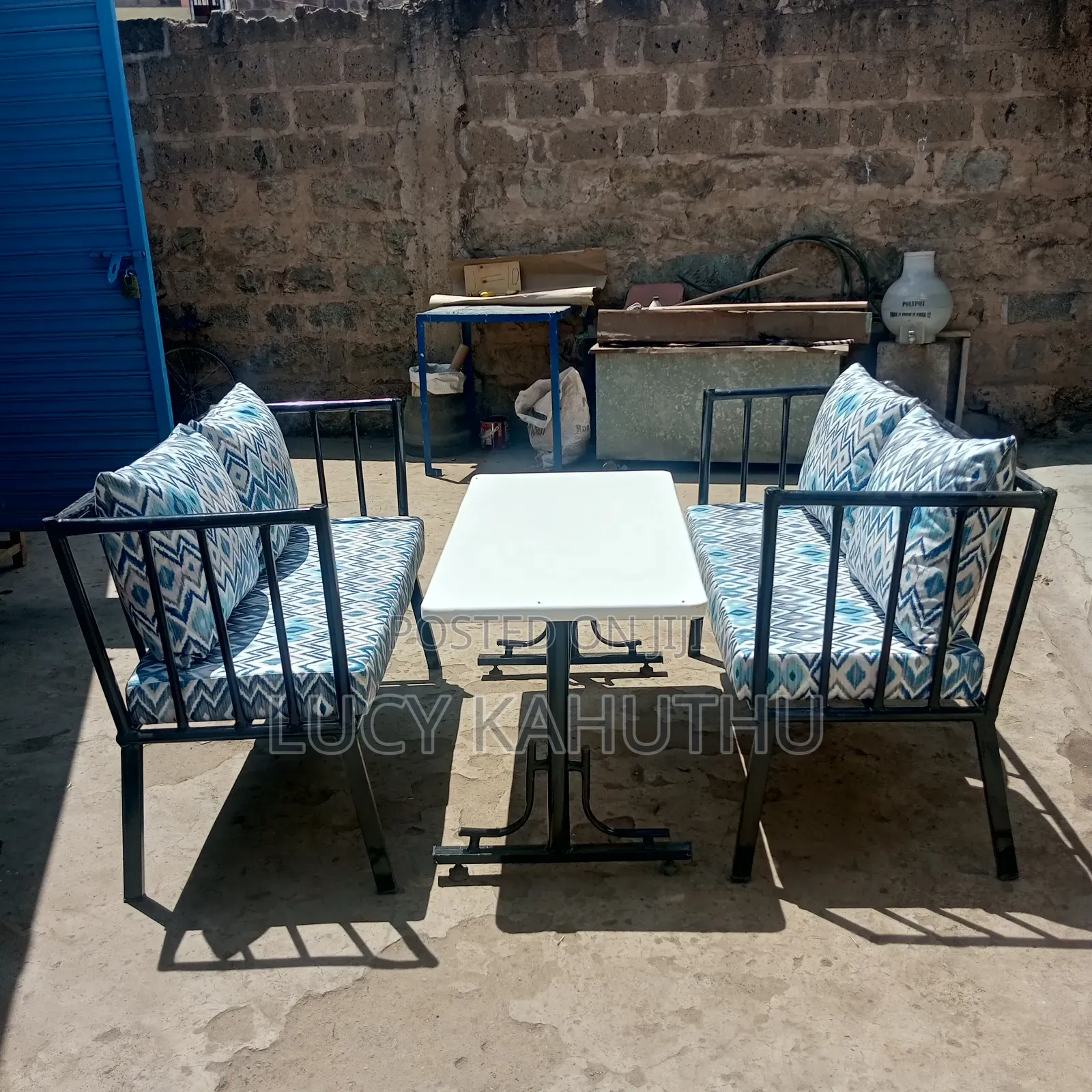 Two Metal Bench With Cushions and 4by 2 Table