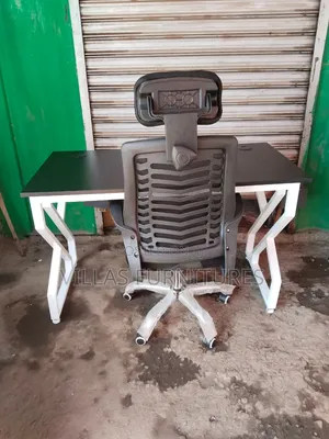 Study Table and High Egornomic Headrest Chair for Clear Workspaces