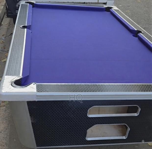 A Brand New Pool Table in Shop With Substantial Locks