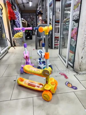 Kids Scooter With a Seat and Flickering Lights on Wheels
