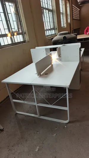 This Modern 4-Way Office Workstation Features a White and Dark Grey
