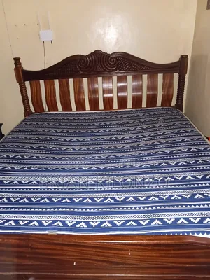 Mahogany 6 by 6 Bed Slightly Used but in Good Condition.