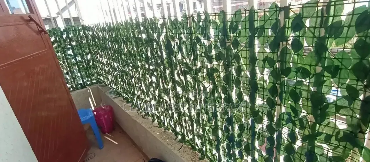 Enjoy Privacy With a Modern Green Finish With Artificial Privacy Fence