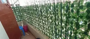 Enjoy Privacy With a Modern Green Finish With Artificial Privacy Fence