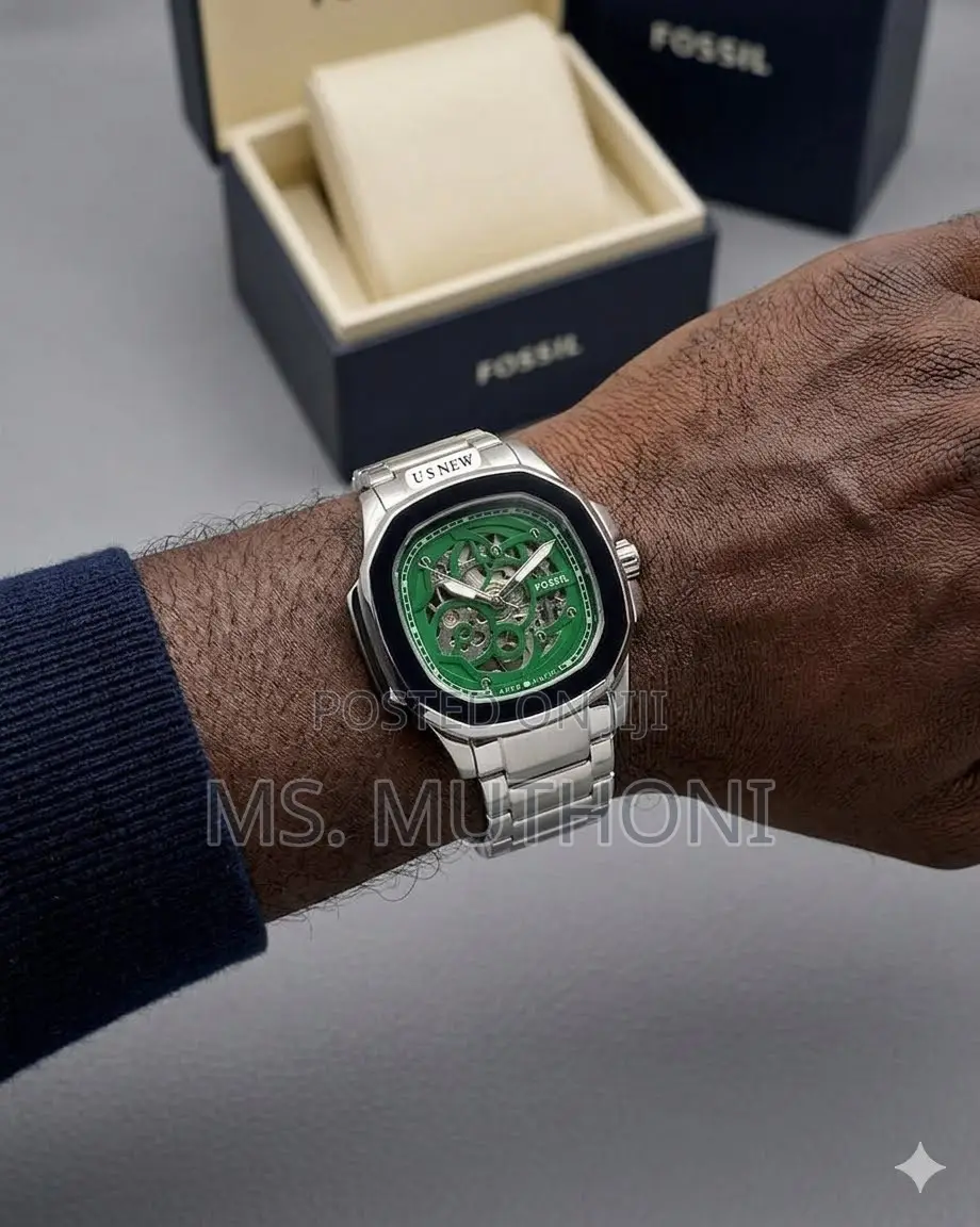 Silver S. Steel Strap Automatic Fossil With Green Skeleton Dial