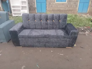Navy Channel-Tufted Sofa With Gold Cup Holders Trim