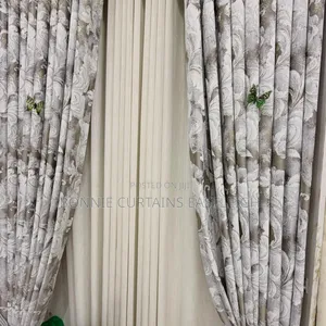 Grey Curtains and Cream Sheers With Rings