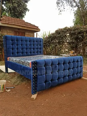 Blue Tufted 5 by 6 Bed