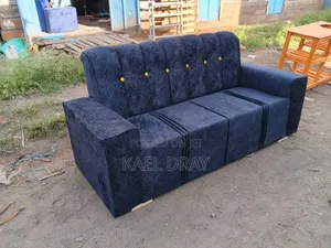 Black Channel-Tufted Sofa With Gold Button Detailing