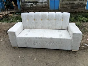Cream Channel-Tufted Sofa With Gold Button Detailing