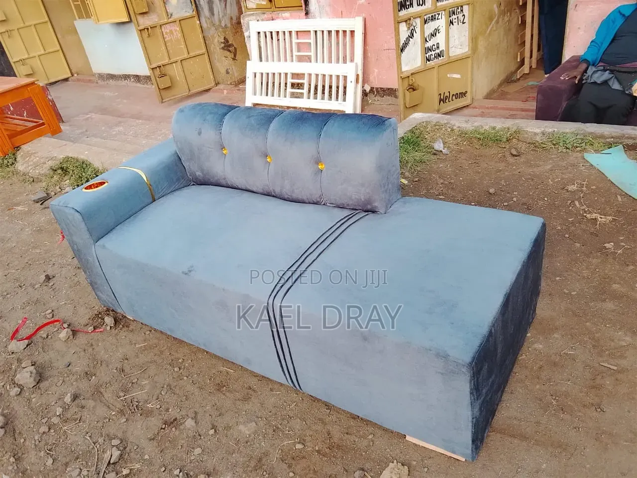 Black Channel-Tufted Sofa With Gold Cup Holder