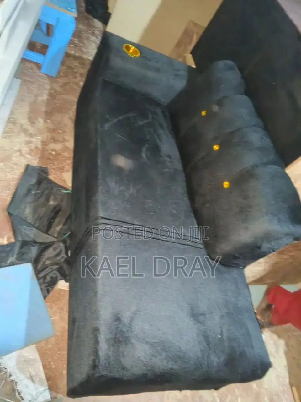 Black Channel-Tufted Sofa With Gold Cup Holder