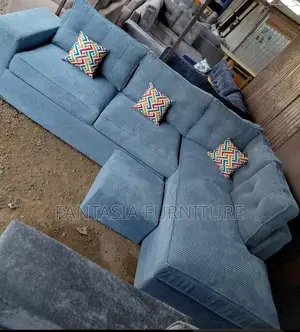5 Seater Light Grey Textured Chaise Sofa + Footrest